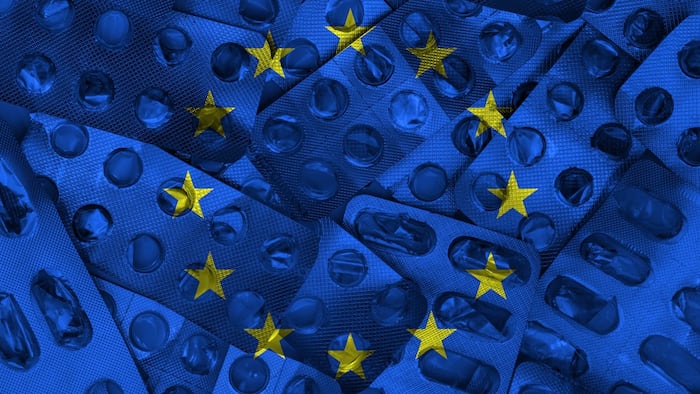 Empty blister packs with EU flag, medicines shortage concept