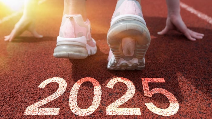 Sprinter on starting blocks With 2025 text