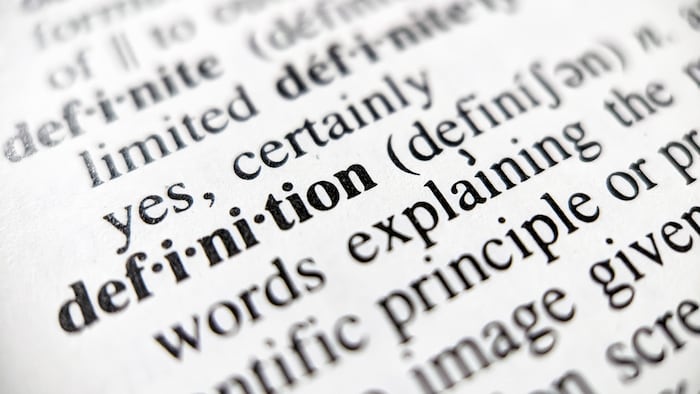 close up of a dictionary on the word "definition"