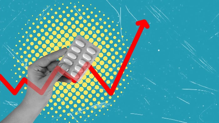 Hand with a pack of pills and an arrow showing drug price increase