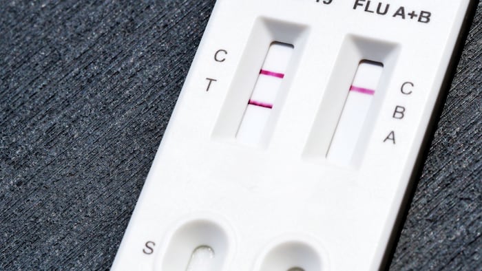 A sample test for COVID-19 and influenza, indicating a positive result for the coronavirus.