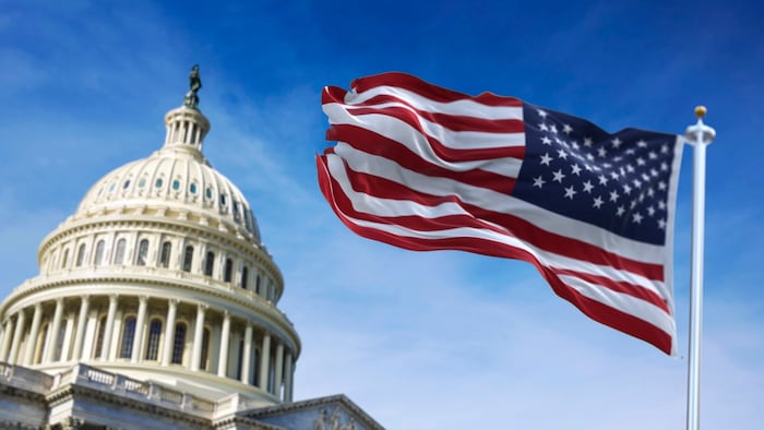 US flag in front of the Capitol Hill