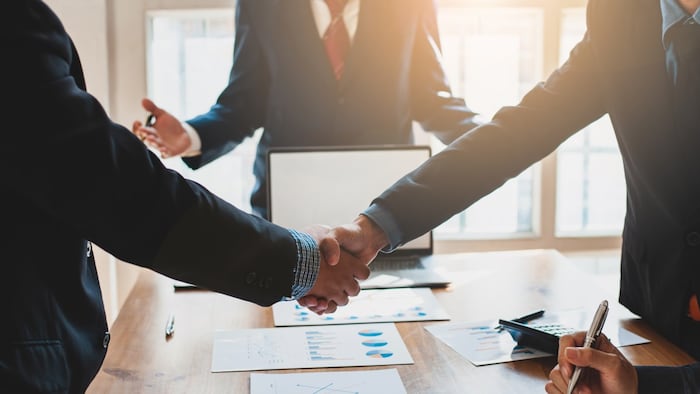 Handshake, striking a deal, settlement