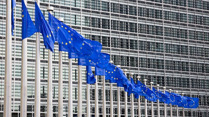 Many flags in front of the EU Commission building in Brussels