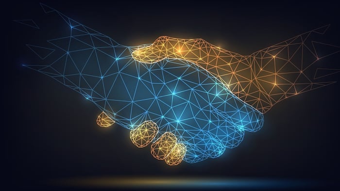 Two wire-frame glowing hands, handshake, technology, business, trust concept